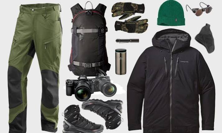 This image contains all that is needed when going for Gorilla Treking. This includes long Trousers, jackets, head gear, Binoculors and glasses.